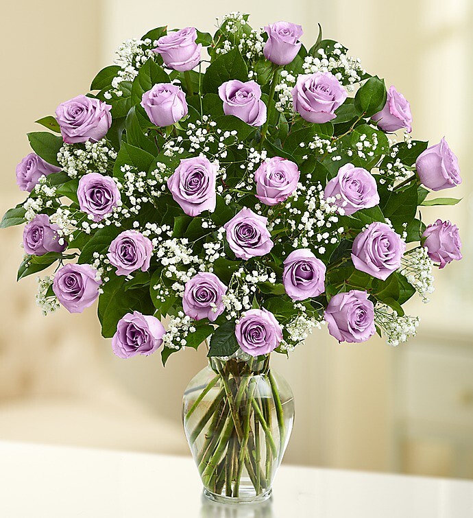 Ultimate Elegance™ Long Stem Purple Roses arranged by a florist in Burr